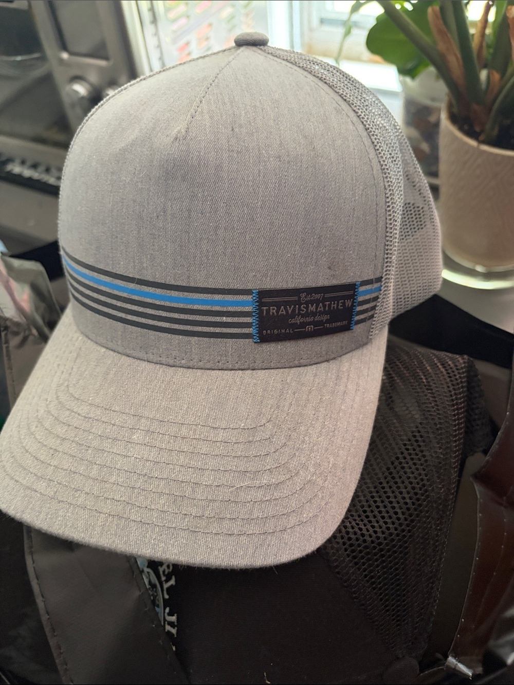 Travis Mathew Light Gray Trucker Hat with Blue Accent